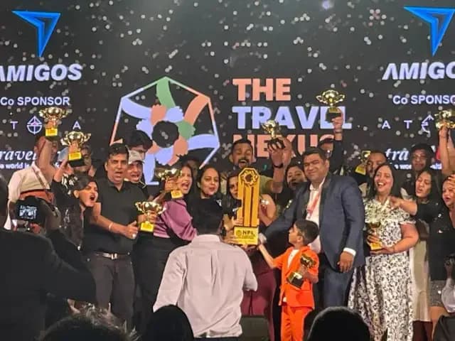 Members on stage holding trophies aloft amid confetti at a Nexus awards presentation