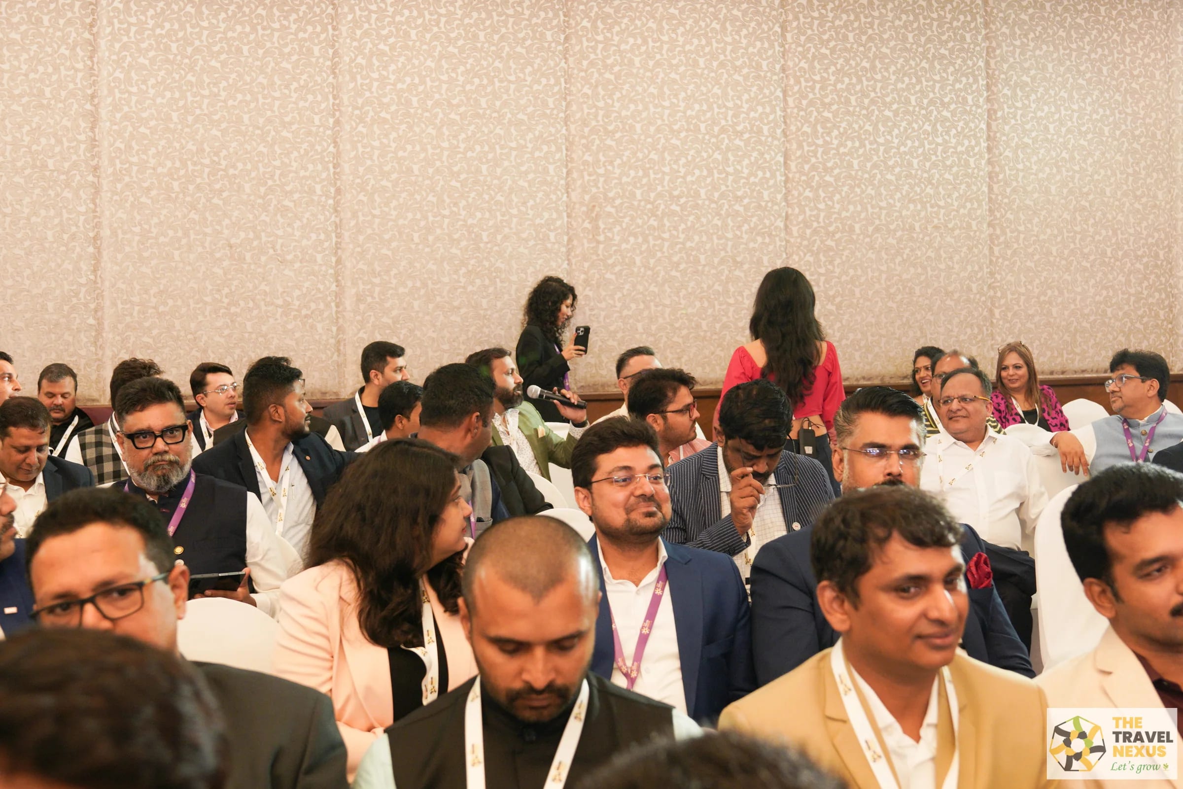 Delegates meeting across the room at The Travel Nexus 1.0