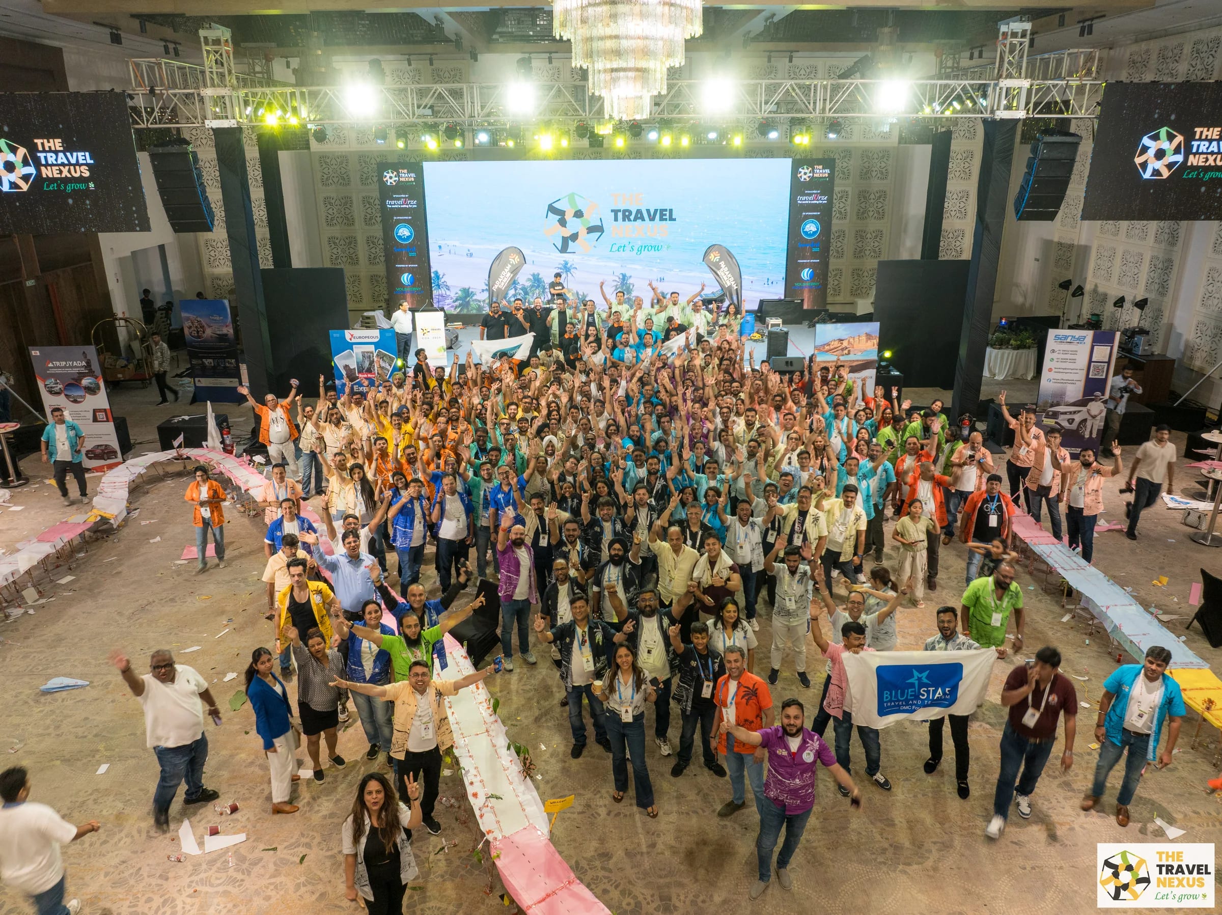 A large overhead group photograph at The Travel Nexus 3.0 in Goa