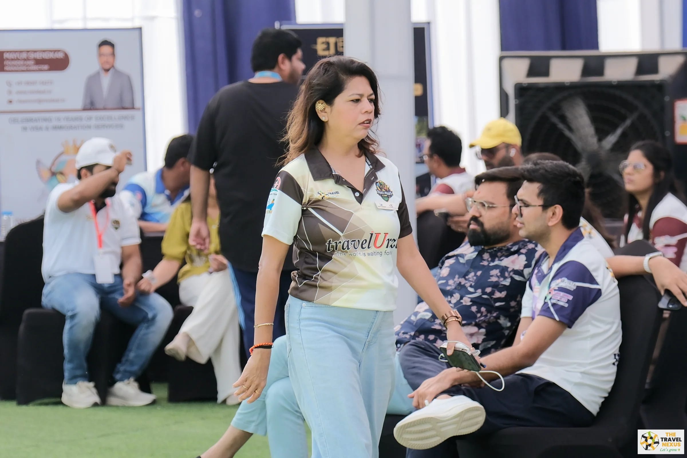 A Travel Nexus Cup player walking beside the field